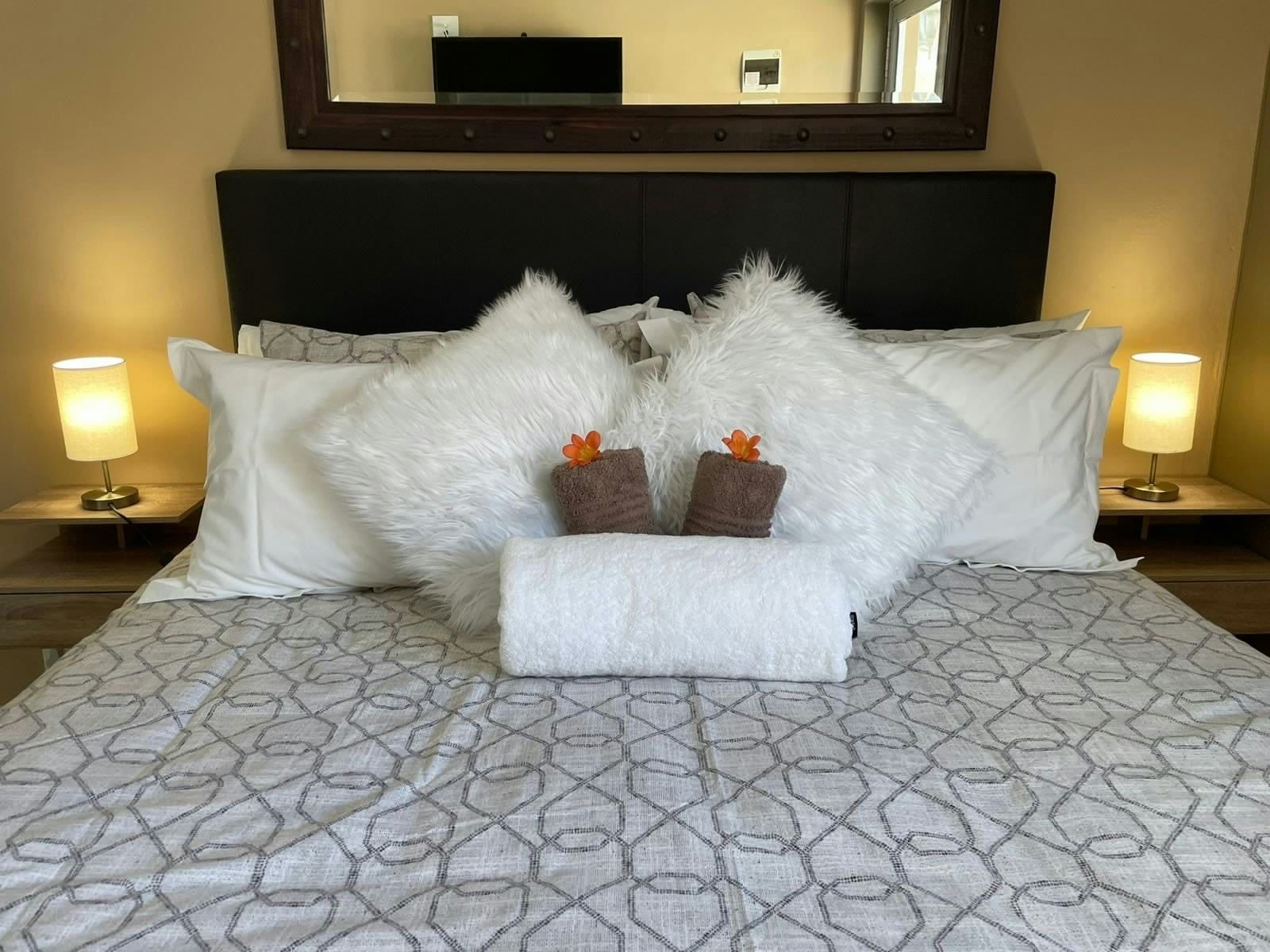 Queen bed made up with fresh linen