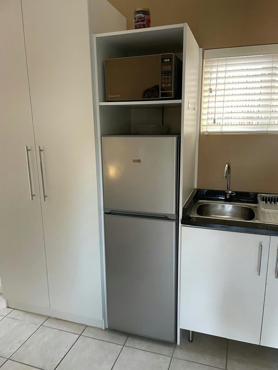 Fridge-freezer and microwave