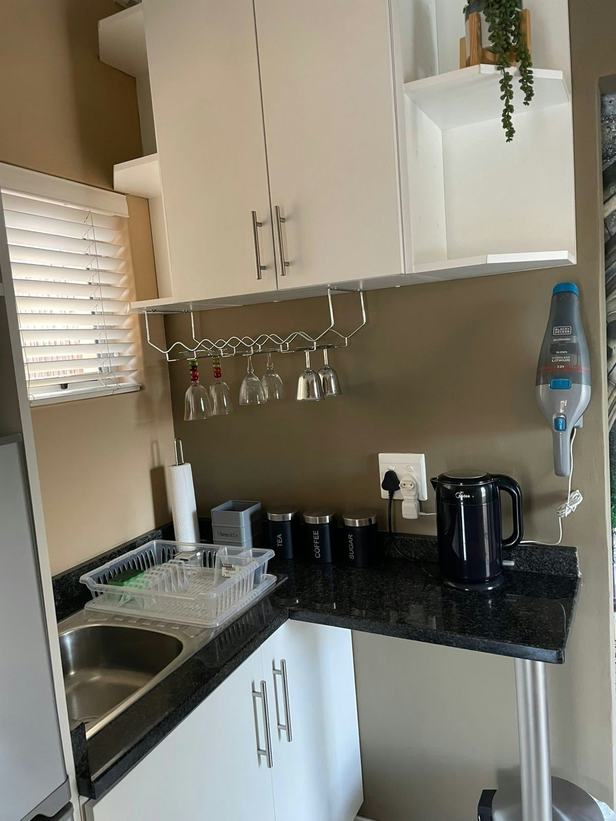 Kitchenette with kettle and sink