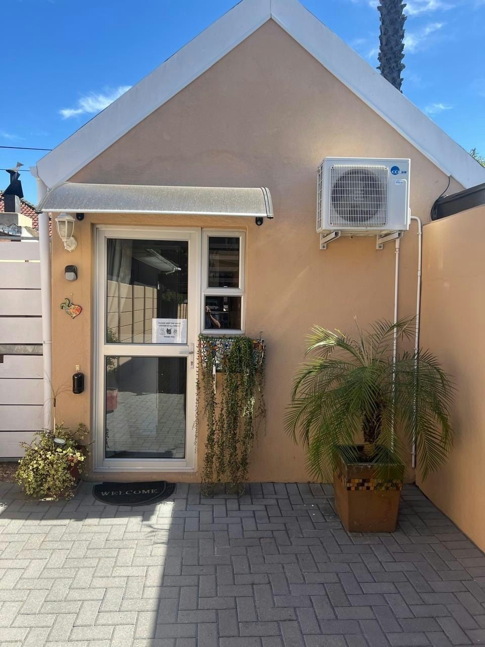 Front door with potted plants
